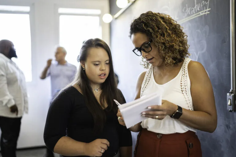 Special Needs Woman learning with leadership